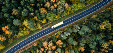 A truck on a winding highway A truck on a winding highway