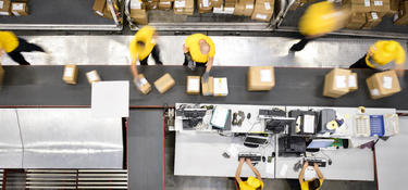 Processing and sorting packages inside a distribution center