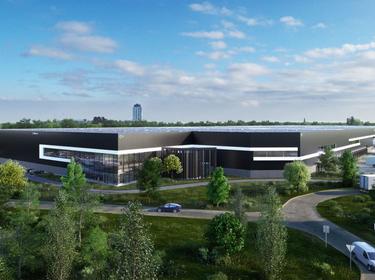 Rendering of a warehouse with a road leading to it and trees in front