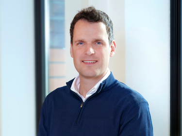 Martijn Kuijken standing in the office
