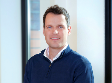 Martijn Kuijken standing in the office