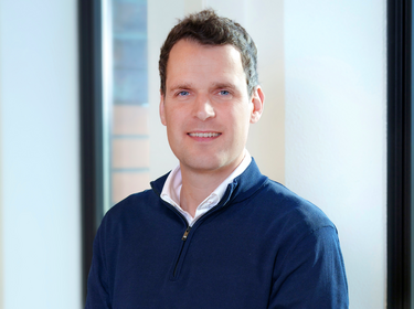 Martijn Kuijken standing in the office